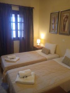 Posteľ alebo postele v izbe v ubytovaní Thiamis Guesthouse