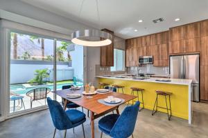 a kitchen and dining room with a table and chairs at Mid-Century Modern Home with Pool Hike and Golf in Palm Springs