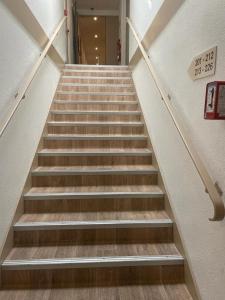 a staircase in a building with a sign on it at Lemon Hotel Plan de Campagne Marseille in Septèmes-les-Vallons