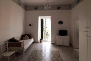 TV a/nebo společenská místnost v ubytování Appartamento Talia Relais Meta di Sorrento + 5 fotografií