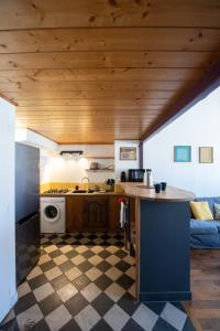 a kitchen with a counter and a stove top oven at L'Indigo- Coup de coeur Canut - Croix Rousse in Lyon