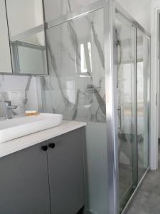 a white bathroom with a sink and a shower at Villa Narlibahce in Ortaca +27 photos
