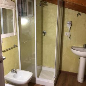a bathroom with a shower and a toilet and a sink at Emma's house in Sorrento