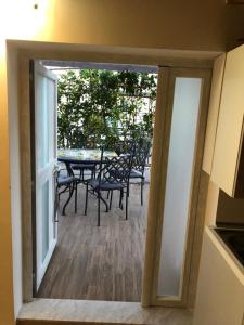 a view of a balcony with a table and chairs at Emma's house in Sorrento