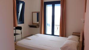 Posteľ alebo postele v izbe v ubytovaní Akti Rooms