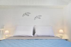 Postel nebo postele na pokoji v ubytování Skopelos Aerino house