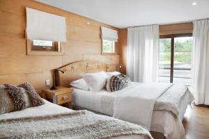Postel nebo postele na pokoji v ubytování Palafito 1326 Hotel Boutique Chiloé