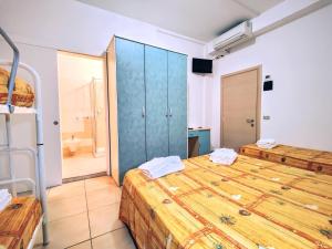 Postel nebo postele na pokoji v ubytování Hotel Ben Hur + 34 fotografií