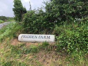 a sign that says hidden farm in the grass at The Annexe at Pridden in Saint Buryan