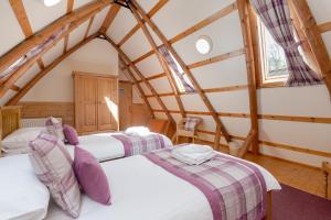 מיטה או מיטות בחדר ב-Rabbie Burns Lodge