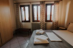 Postel nebo postele na pokoji v ubytování House of Gardenia