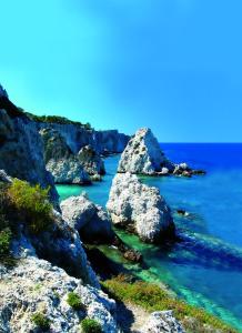 a group of rocks in the water near the ocean at Hotel Kyrie Isole Tremiti in San Domino
