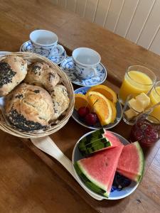 a table topped with plates of bread and fruit at Sølyst in Silkeborg +27 photos
