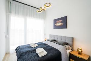 Postel nebo postele na pokoji v ubytování Kincső Apartman