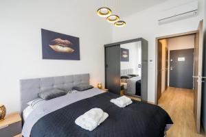 Posteľ alebo postele v izbe v ubytovaní Kincső Apartman