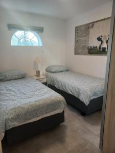 Postel nebo postele na pokoji v ubytování B&B De Kaagse Boer