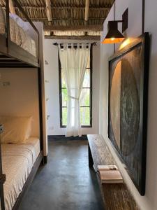 Ein Etagenbett oder Etagenbetten in einem Zimmer der Unterkunft Wayuu