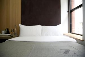 Voodi või voodid majutusasutuse The Z Hotel Piccadilly toas