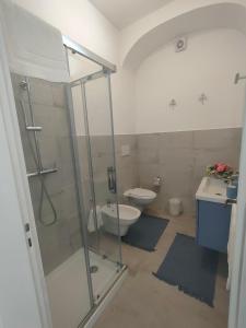 a bathroom with a shower and a toilet and a sink at Positanobay in Positano