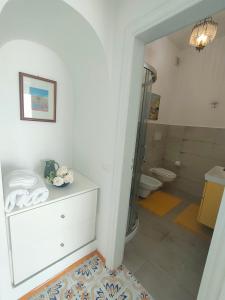 a bathroom with a shower and a sink and a toilet at Positanobay in Positano