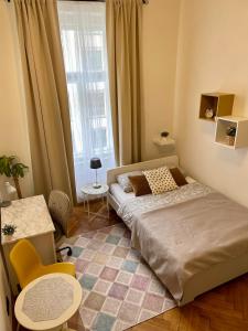 A bed or beds in a room at Krasova Apartments