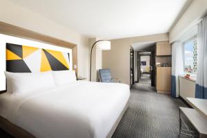 a hotel room with a large bed and a window at M Social Hotel Times Square New York in New York