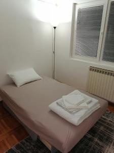 Postel nebo postele na pokoji v ubytování Apartman Radulović