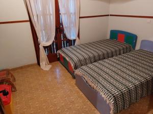 Postel nebo postele na pokoji v ubytování Villa Anesis-Παραθαλάσσια βίλα