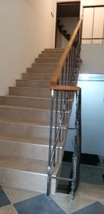 a set of stairs in a building with a metal railing at TOMiSLAV in Zagreb