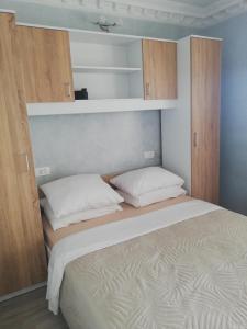Postel nebo postele na pokoji v ubytování apartmani Zoran Bilić