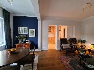 a living room with a table and chairs at Apartments GB in Mostar