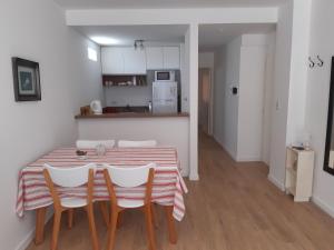 a kitchen with a table and chairs in a room at BELGRANO LUMINOSO Y AMPLIO DEPARTAMENTO in Buenos Aires +10 photos