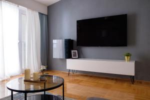 Televízia a/alebo spoločenská miestnosť v ubytovaní Formin - Lux Apartment