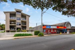 an apartment building on the corner of a street at Keith's on Pumicestone, 1 of the 4 most popular units on Bribie in Bongaree