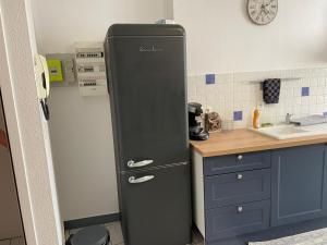 Kuchnia lub aneks kuchenny w obiekcie Joli appartement climatisé