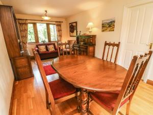 a dining room with a wooden table and chairs at Horton Scar House in Horton in Ribblesdale