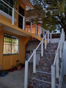 a house with stairs in front of it at Viento Casa los 4 elementos in Cancún
