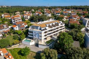 an aerial view of a building in a city at Apartment HANA in Pješčana Uvala 