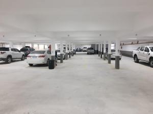 a parking garage with cars parked in it at Apart 312 Casa de Playa in Necochea