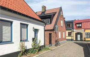 a row of houses in a street at Awesome Home In Ystad With 1 Bedrooms And Wifi in Ystad