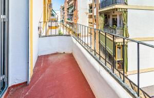 a balcony of a building with a red floor at Gorgeous Apartment In Cordoba With Wifi in Córdoba
