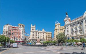 a group of buildings in a city with a fountain at Gorgeous Apartment In Cordoba With Wifi in Córdoba