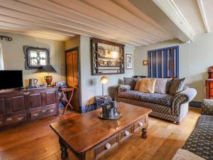 a living room with a couch and a coffee table at The Dairy in Haworth