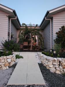 a walkway in front of a house at Country Luxury in Scarsdale