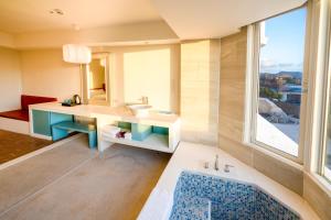 Voodi või voodid majutusasutuse Kenting Long Beach Hotel toas