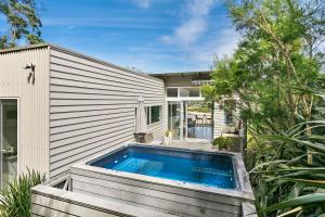 a swimming pool in the backyard of a house at Drift - Luxury, location and ocean views in Wye River