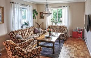 a living room with a couch and a table at Beautiful Home In Sunnemo With Wifi And 2 Bedrooms in Sunnemo