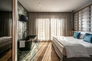 Ένα ή περισσότερα κρεβάτια σε δωμάτιο στο Aqua Villa Complex