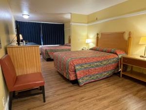 Postel nebo postele na pokoji v ubytování Marina Inn Des Moines / SeaTac