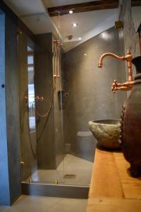 a bathroom with a sink and a shower at The Hans Apartment - cosy and special in Klaksvík